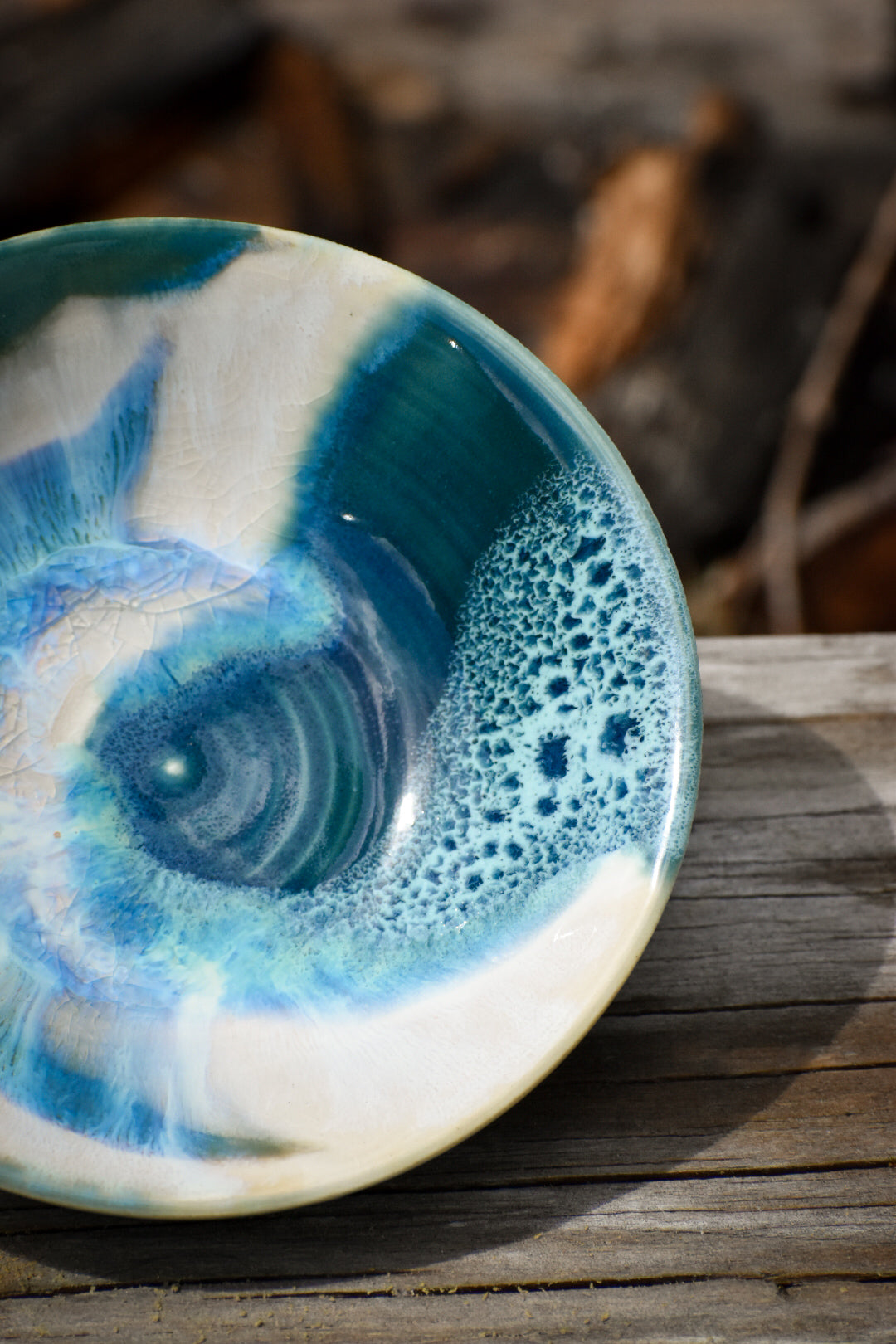 Turquoise and white intricate ceramic bowl